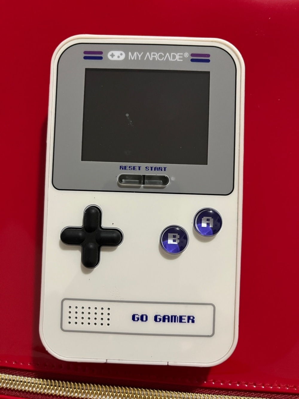 Arcade GO GAMER White Handheld Console with Black D-pad and Purple Buttons